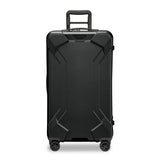 Briggs & Riley Torq medium black spinner trunk with four wheels and sturdy handle for easy travel and luggage durability.