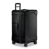 Briggs & Riley Torq medium trunk spinner suitcase in stealth black with four spinner wheels and durable hard shell.
