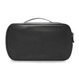 Briggs & Riley Baseline expandable toiletry kit with multiple compartments and clear zippered pockets for travel essentials.