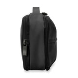 Briggs & Riley Baseline expandable toiletry kit with multiple compartments, black nylon exterior, and organized interior for travel essentials.