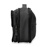 Briggs & Riley Baseline expandable toiletry kit with multiple compartments and a sleek black design for travel organization.