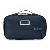 Briggs & Riley Baseline expandable toiletry kit with multiple compartments and a sleek design for travel organization.