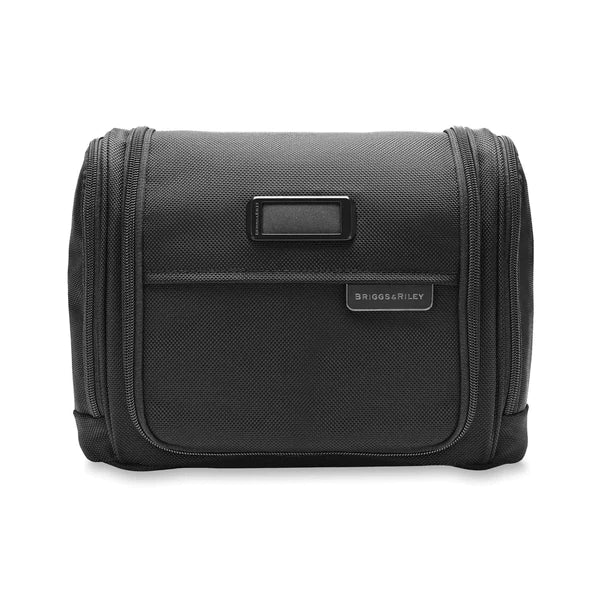 Briggs & Riley Baseline Deluxe Hangable Toiletry Kit with zipped compartments and hanging hook, made of durable fabric.