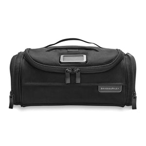 Briggs & Riley Baseline Executive Essentials toiletry kit with zippered compartments and durable nylon material.
