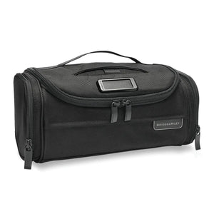 Briggs & Riley Baseline Executive Essentials Toiletry Kit with multiple compartments and zipper closure, designed for travel organization.