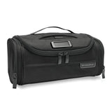 Briggs & Riley Baseline Executive Essentials Toiletry Kit with multiple compartments and zipper closure, designed for travel organization.