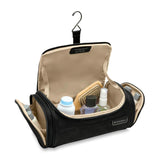 Briggs & Riley Baseline Executive Essentials toiletry kit with multiple compartments and zipper closure for travel organization.