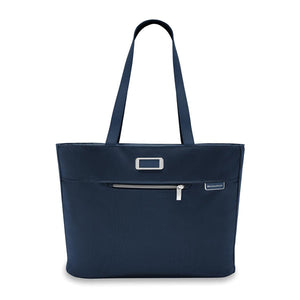 Briggs & Riley Baseline traveler tote bag in black fabric with leather handles and multiple compartments for travel essentials.