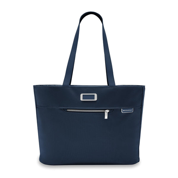 Briggs & Riley Baseline traveler tote bag in black fabric with leather handles and multiple compartments for travel essentials.