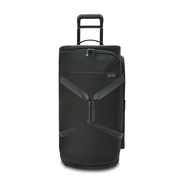 Briggs & Riley Baseline medium two-wheel duffle bag in blue with sturdy handles and wheels, designed for travel and easy carrying.