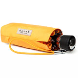 Yellow Davek Mini Umbrella open, compact design with sturdy frame, perfect for rain protection and travel.