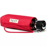 Red Davek Mini Umbrella open, showing compact design and sturdy frame, perfect for portable rain protection.