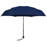 Open navy Davek Mini umbrella showcasing compact design and sturdy frame in a natural outdoor setting.