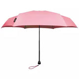 Open pink Davek Mini Umbrella showing its compact design and sturdy frame, perfect for travel and everyday use.