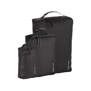 Eagle Creek PACK-IT™ Isolate Cube Set XS, S, and M for organizing clothes and accessories in luggage, shown in black.