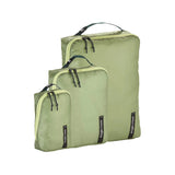Eagle Creek PACK-IT™ Isolate Cube Set in small, medium, and large sizes for organizing travel essentials in a luggage compartment.