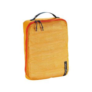 Eagle Creek PACK-IT™ Reveal Cube M showing organized packing cube with mesh panels and zipper closure for travel storage.