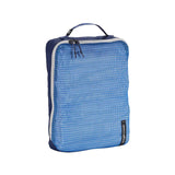 Eagle Creek PACK-IT™ Reveal Cube M organizer with transparent compartments for packing and organizing travel essentials.
