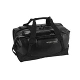 Eagle Creek Migrate 40L duffel bag in black with shoulder straps and zipper closure, showing durable fabric and compact design.