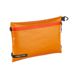 Eagle Creek PACK-IT™ Gear Pouch M for packing organization, shown open with compartments for travel essentials.
