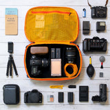 Eagle Creek PACK-IT™ Gear Protect-It Cube S used for packing organization, showcasing a compact, gray cube with compartments.