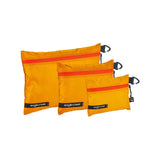 Eagle Creek PACK-IT Isolate Sac Set XS, S, M for packing organization, shown in various sizes with zipper closures and mesh panels.