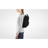 Fjallraven Kanken backpack in frost green with adjustable shoulder straps and front zip pocket, made from durable fabric.