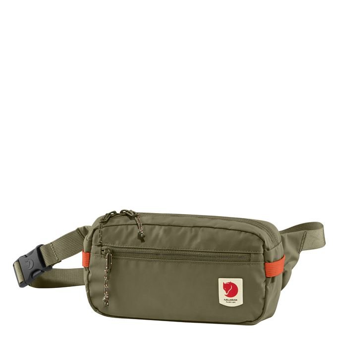 Green Fjallraven High Coast Hip Pack worn around the waist, showcasing its compact, functional design for outdoor activities.