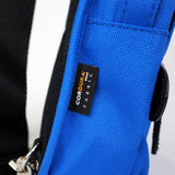 Harvest Label sling pack in black with adjustable strap, compact design, and multiple compartments for everyday carry.