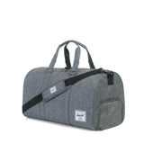 Herschel Novel Duffle bag in black with leather accents, featuring dual handles and a spacious main compartment.