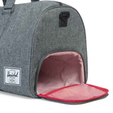 Herschel Novel Duffle bag in black with leather accents, featuring dual top handles and a spacious main compartment.