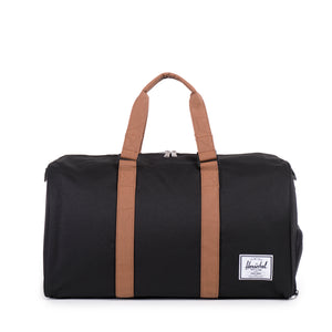 Herschel Novel Duffle bag in black with sturdy handles and zip closure, designed for travel and daily use.