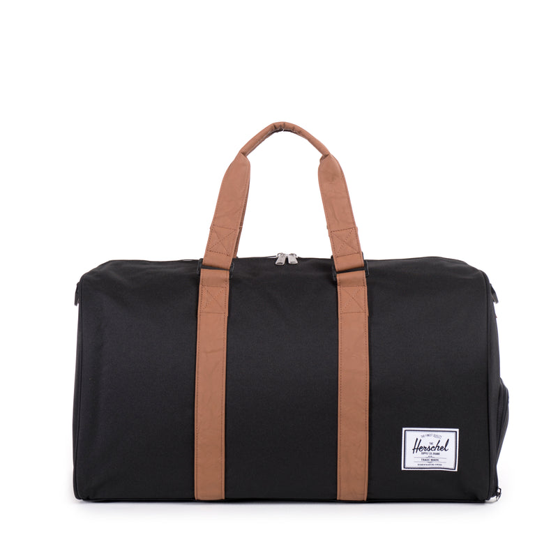 Herschel Novel Duffle bag in black with sturdy handles and zip closure, designed for travel and daily use.