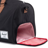 Herschel Novel black duffle bag with sturdy handles and zipper closure, made from durable fabric for travel and everyday use.
