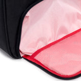 Black Herschel Novel Duffle bag with adjustable shoulder strap and multiple compartments, displayed on a plain background.