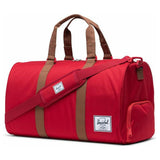 Herschel Novel Duffle bag with leather accents, spacious main compartment, and adjustable shoulder strap, in black fabric.