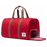 Herschel Novel Duffle bag in black with adjustable shoulder strap and spacious main compartment, stylish and durable for travel.