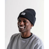 Herschel Elmer Beanie featuring colorful Simpsons character design, knitted fabric, and snug fit for casual winter style.
