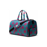Herschel Novel Duffle bag featuring Simpsons design with adjustable straps, main zip compartment, and carrying handles.