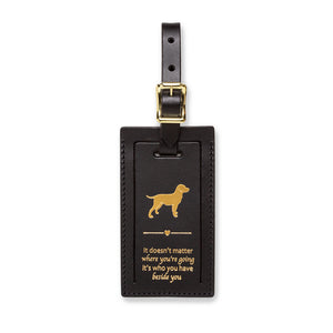 Index Urban luggage tag featuring a colorful design with the phrase "It Doesn't Matter Where You're Going" for dog lovers.
