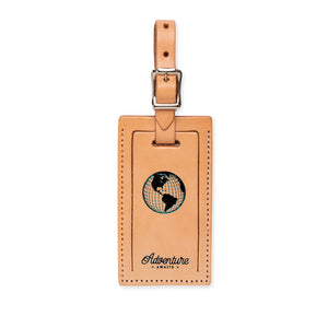 Index Urban luggage tag featuring a globe design with "Adventure Awaits" text, perfect for travel and bag identification.
