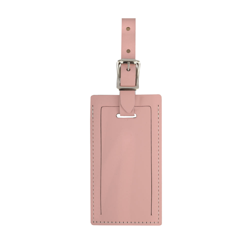 Pink personalized leather luggage tag by Index Urban, made in USA, featuring custom name embossing and durable leather material.