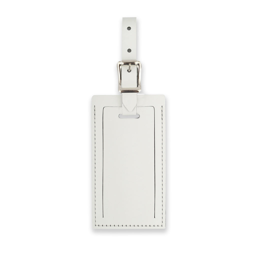 White personalized leather luggage tag by Index Urban, made in the USA, with adjustable strap and clear identification window.