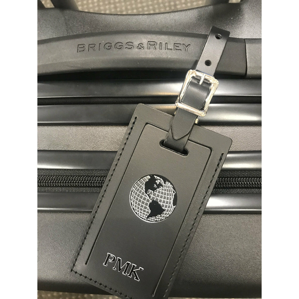 Personalized leather luggage tag by Index Urban, made in USA, with clear identification window and durable leather strap.