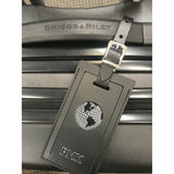 Personalized leather luggage tag by Index Urban, made in USA, with clear identification window and durable leather strap.