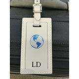 Personalized leather luggage tag by Index Urban, made in USA, featuring a classic design with customizable details for travel.