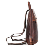 Side view of Jack Georges Voyager Adele Slim Backpack in brown leather, showcasing its sleek design and adjustable shoulder straps.