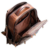 Brown Jack Georges Voyager Tech Backpack with multiple compartments and padded shoulder straps, suitable for tech accessories and daily use.