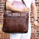 Brown Jack Georges Voyager Professional Briefcase showcasing sleek leather design and sturdy handles for business use.