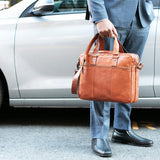 Brown Jack Georges Voyager professional briefcase with sleek design, leather handles, and multiple compartments for organization.